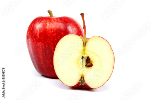 Fresh red apples with a slice.