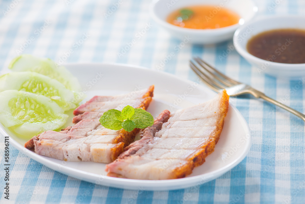 Siu Yuk - Chinese roasted pork served with soy and hoisin sauce. Siu Yuk - Chinese roasted pork served with soy and hoisin sauce.