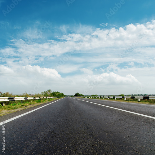 black asphalt road and cloudy horizon