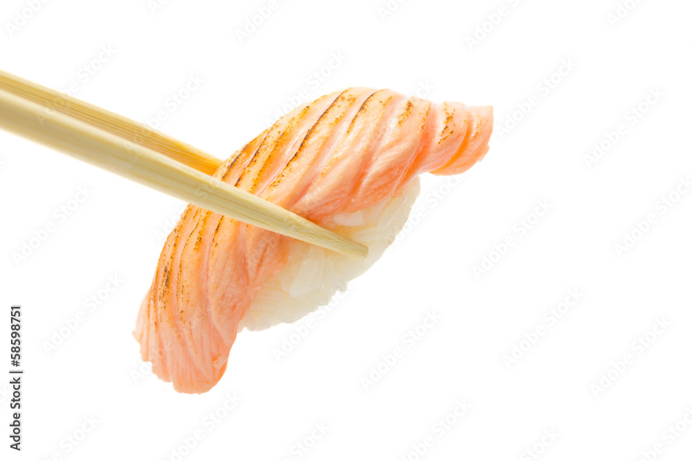 salmon sushi nigiri in chopsticks