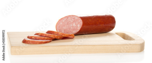 Appetizing sausage on the chopping board