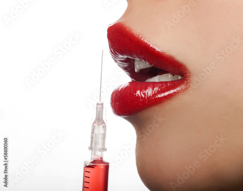 Woman with syringe photo