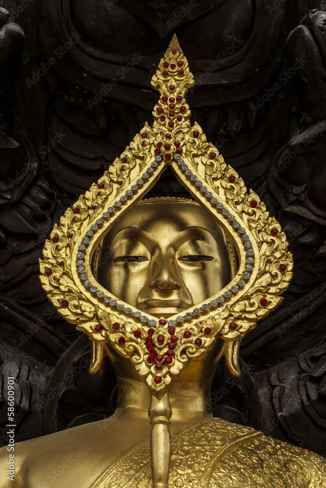 Seated buddha image protected by the seven-headed naga, closed u