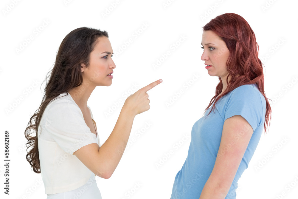 Angry young female friends having an argument Angry young female friends having an argument
