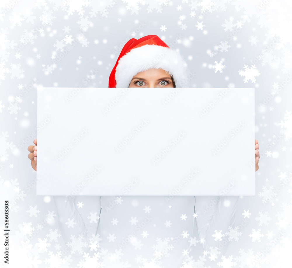 woman in santa helper hat with blank white board