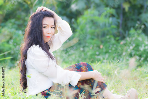 Profile of a young Asian woman in Lawn photo