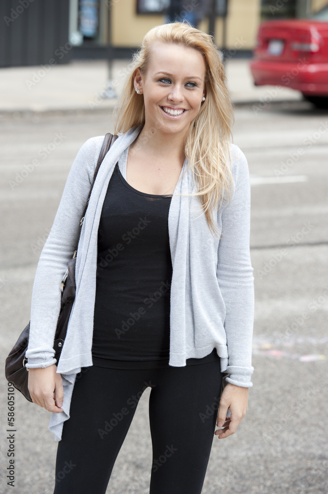 A young gorgeous female blond teen posing on a cloudy day in Chicago. A young gorgeous female blond teen posing on a cloudy day in Chicago.