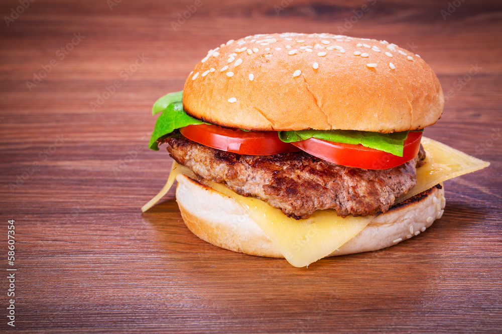 Hamburger with grilled beef, cheese and vegetables Hamburger with grilled beef, cheese and vegetables