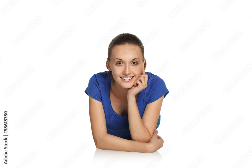 Young girl is lying on the floor and smiling Young girl is lying on the floor and smiling