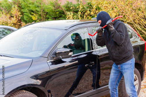 Canvas Print Car burglar in action