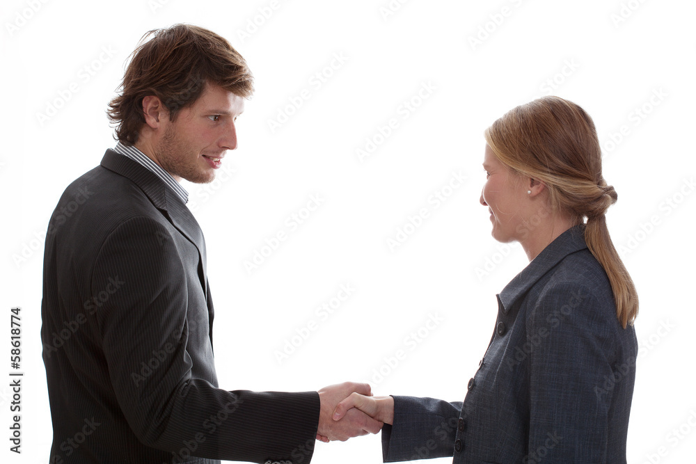 Man shaking woman hand