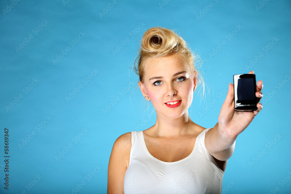 Technology. Retro style happy girl offering mobile phone Technology. Retro style happy girl offering mobile phone