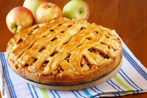 homemade apple pie on wooden table