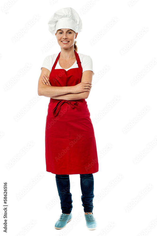 Full length portrait of pretty female chef