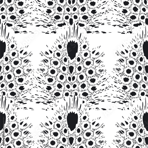 Spotted feathers seamless pattern