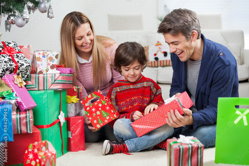 Parents Giving Christmas Present To Son Parents Giving Christmas Present To Son