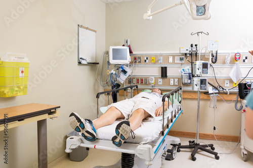 Patient Lying On Bed In Hospital Room