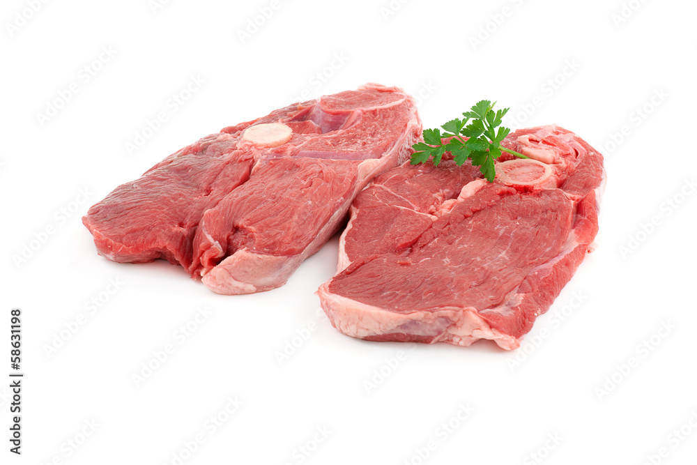 deux tranches de gigots d'ageau crues sur fond blanc deux tranches de gigots d'ageau crues sur fond blanc