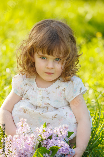 Little girl in a sunny garden