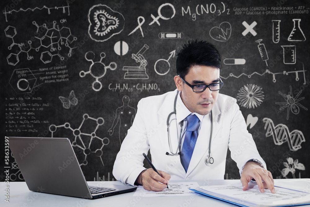 Young doctor working with notebook Young doctor working with notebook
