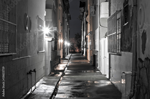 Dark back alley on a wet night