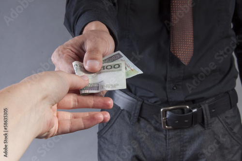 businessman is eating a sandwich with money