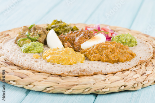 Ethiopian Feast - Injera (sourdough flatbread) with stews photo