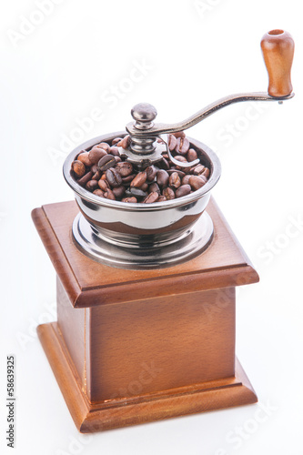 Coffee grinder and coffee beans isolated on white background