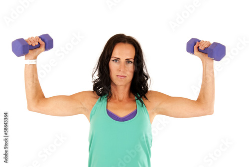 woman showing off her muscles lifting purple barbells