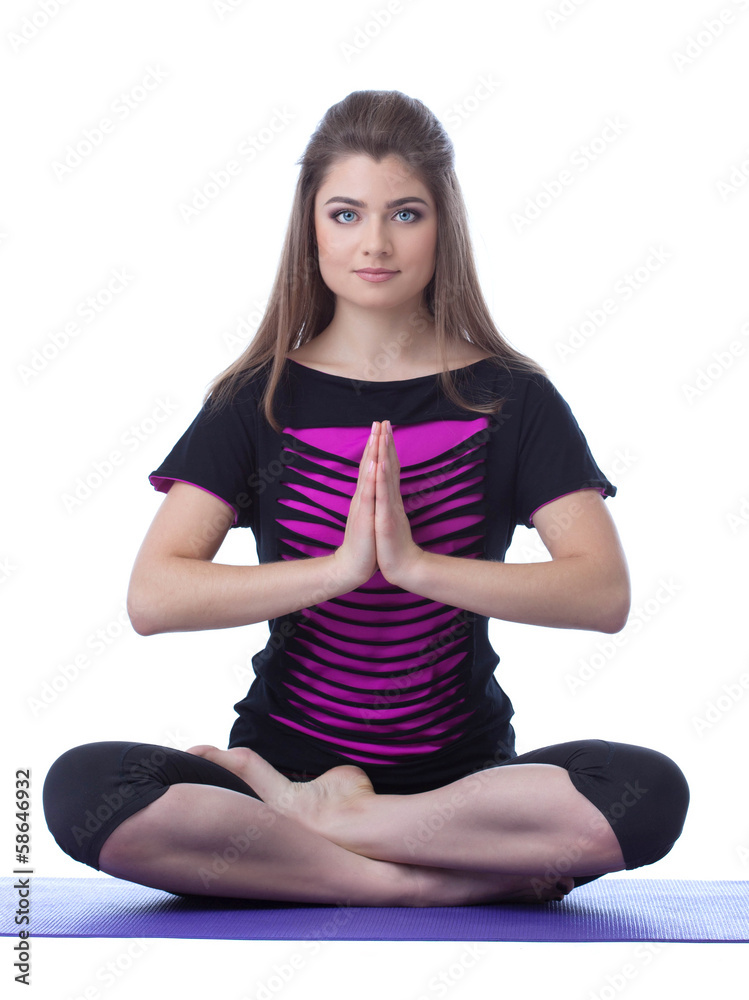Studio shot of beautiful brunette practicing yoga Studio shot of beautiful brunette practicing yoga