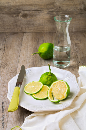 Lemon on plate on wooden table