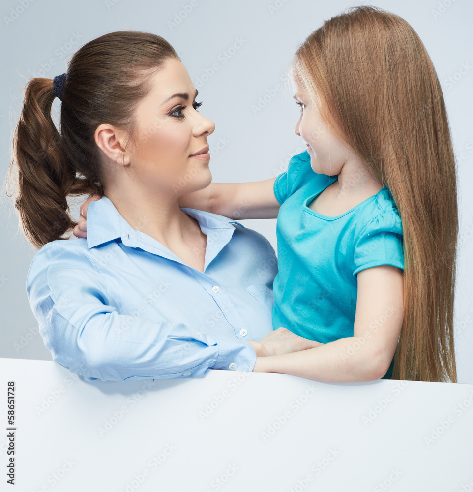 Business woman with kid girl isolated portrait behind white boa Business woman with kid girl isolated portrait behind white boa