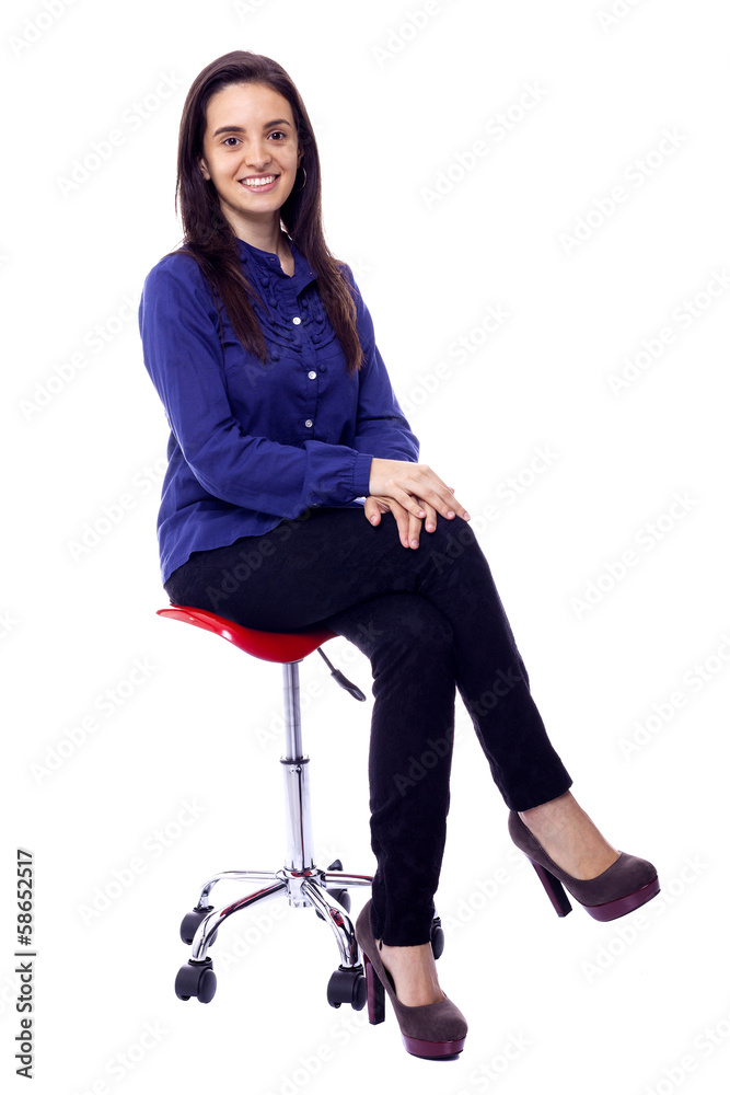 Fototapeta premium Beautiful woman sitting on chair, isolated on white