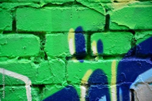 Old brick wall with colorful graffiti