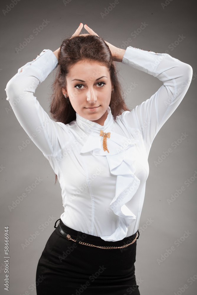 portrait of elegant secretary in blouse looking at camera Photos | Adobe  Stock