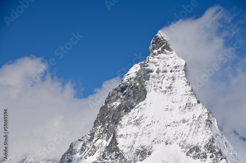 Matterhorn peak among clouds photo