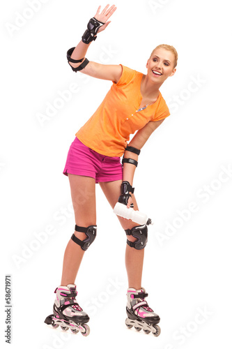 Woman on rollerblades waving hand. © studioloco