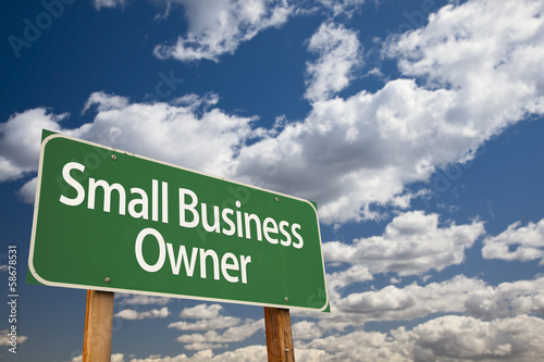 Small Business Owner Green Road Sign and Clouds