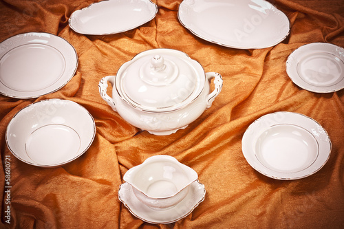 Dinnerware set on orange background