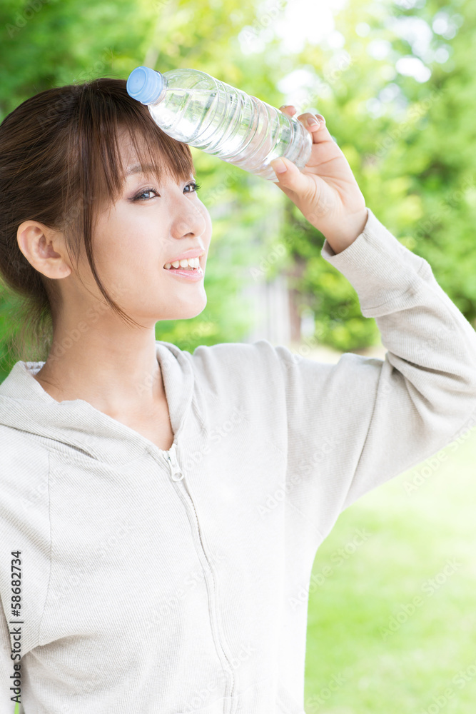 young asian woman relaxing in the park young asian woman relaxing in the park