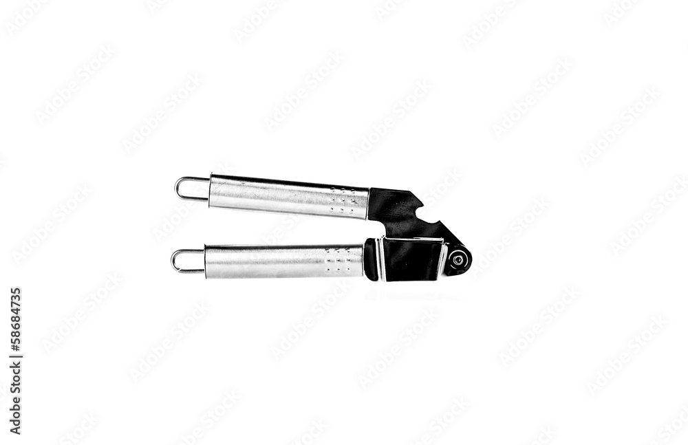 shiny silver garlic press isolated against white background. shiny silver garlic press isolated against white background.