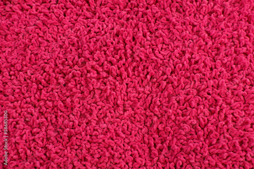 Fleecy pink pillow close-up background