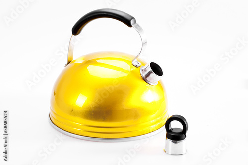 Yellow tea kettle isolated on white background