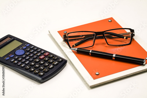 Blank notepad and accessories for secretary in the office, calcu photo