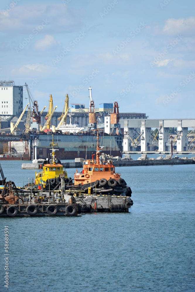 Tugboat and freight train under port crane, Odessa, Ukraine