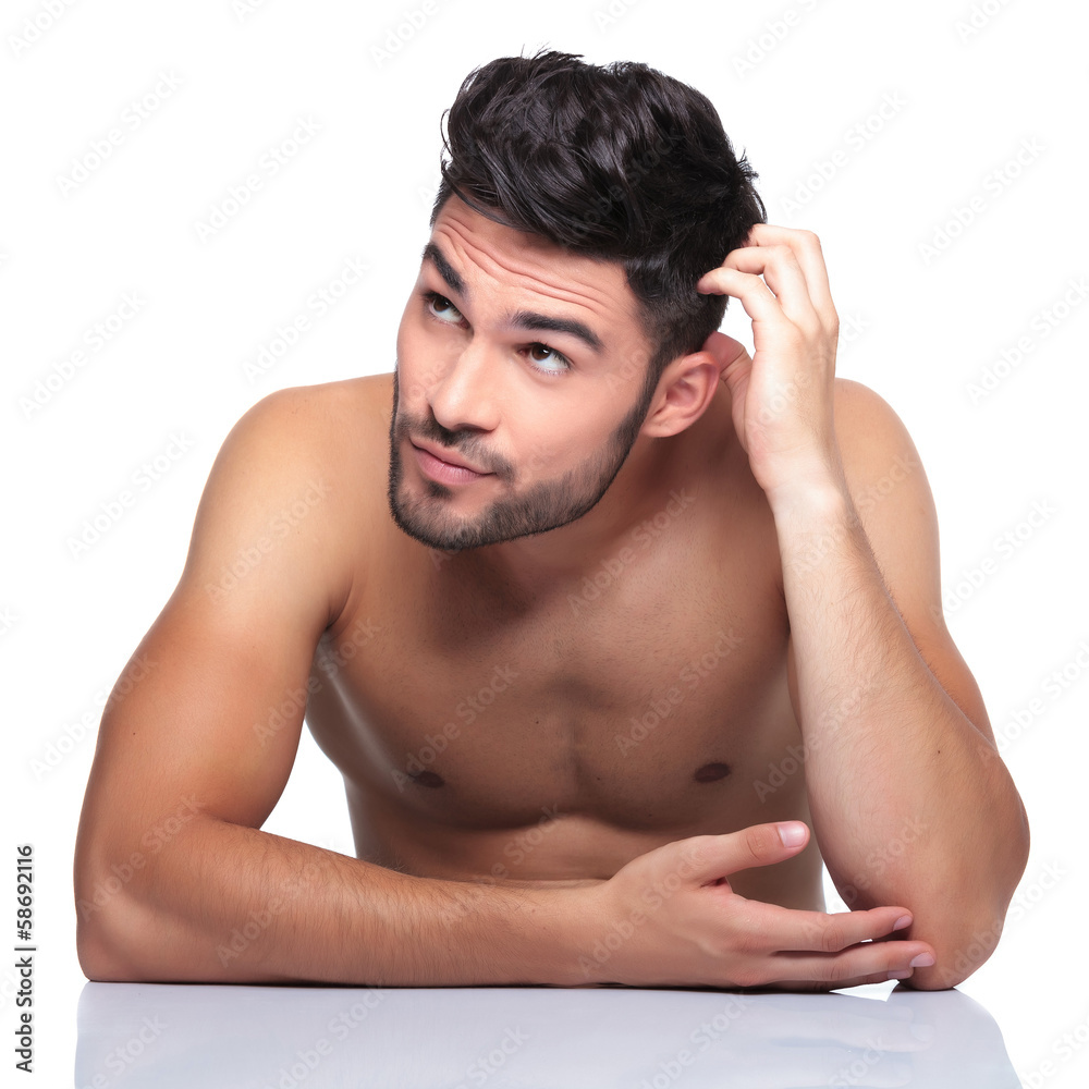 beauty man scratching his head and looking up to his side beauty man scratching his head and looking up to his side