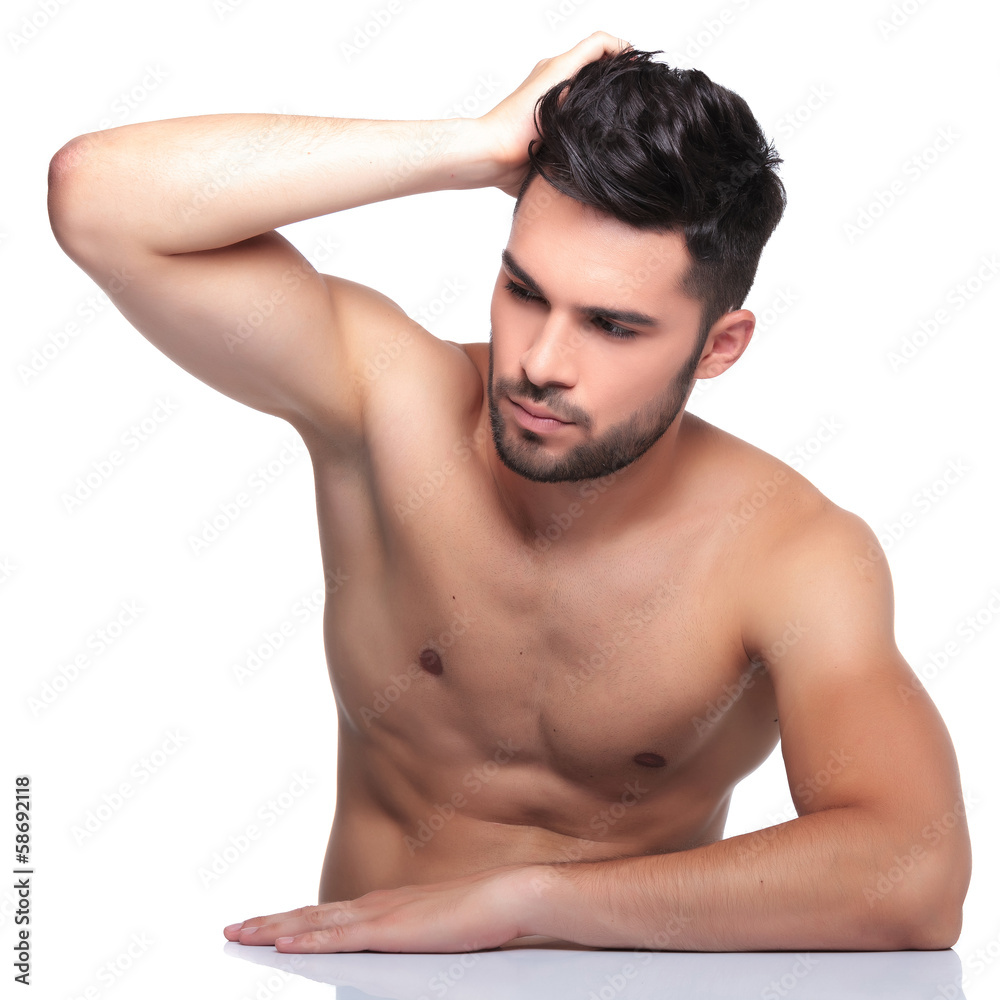 man passing his hand through his hair and looking away man passing his hand through his hair and looking away