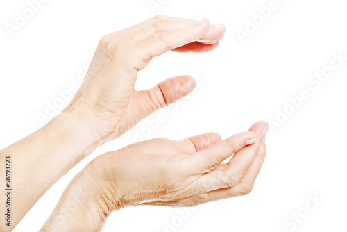 Woman's hands shaped to hold copy space between them.