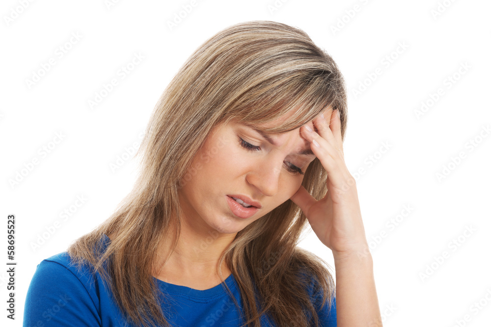 Young attractive woman holding her head, worrying.