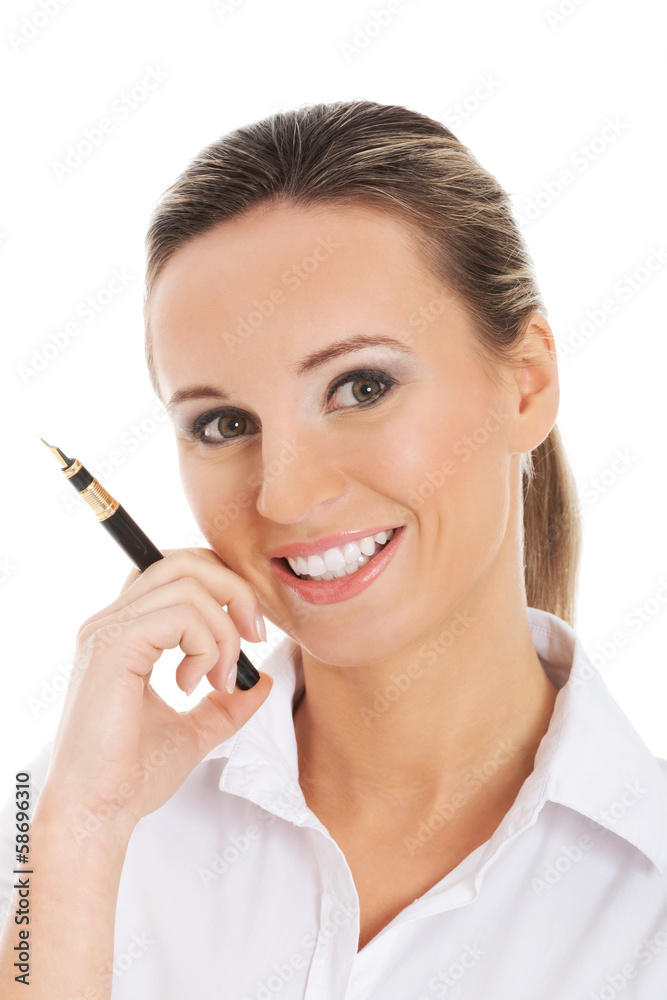 Young business woman holding a pen. Young business woman holding a pen.